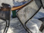 Metal chair backs in the snow.