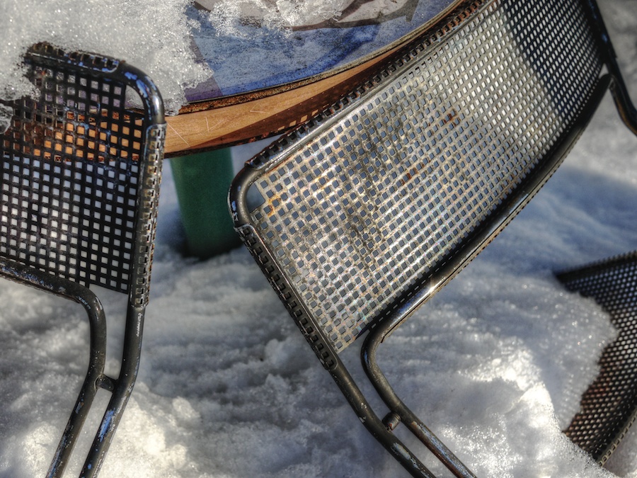 Metal chair backs in the snow.