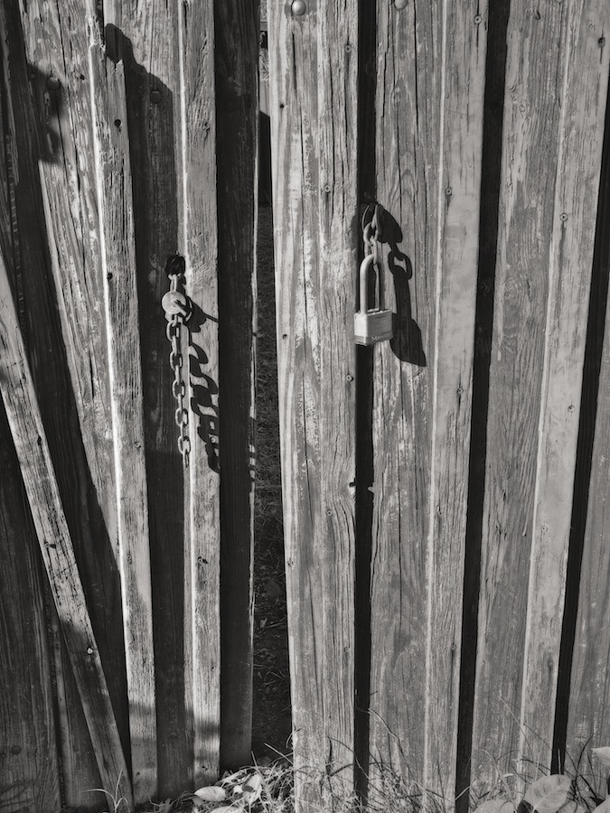 Wooden fence, slightly open.