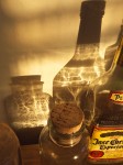 Late afternoon light refracted through glass bottles.