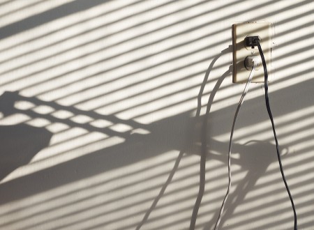 Outlet, wires, shadows. | Click to view larger.