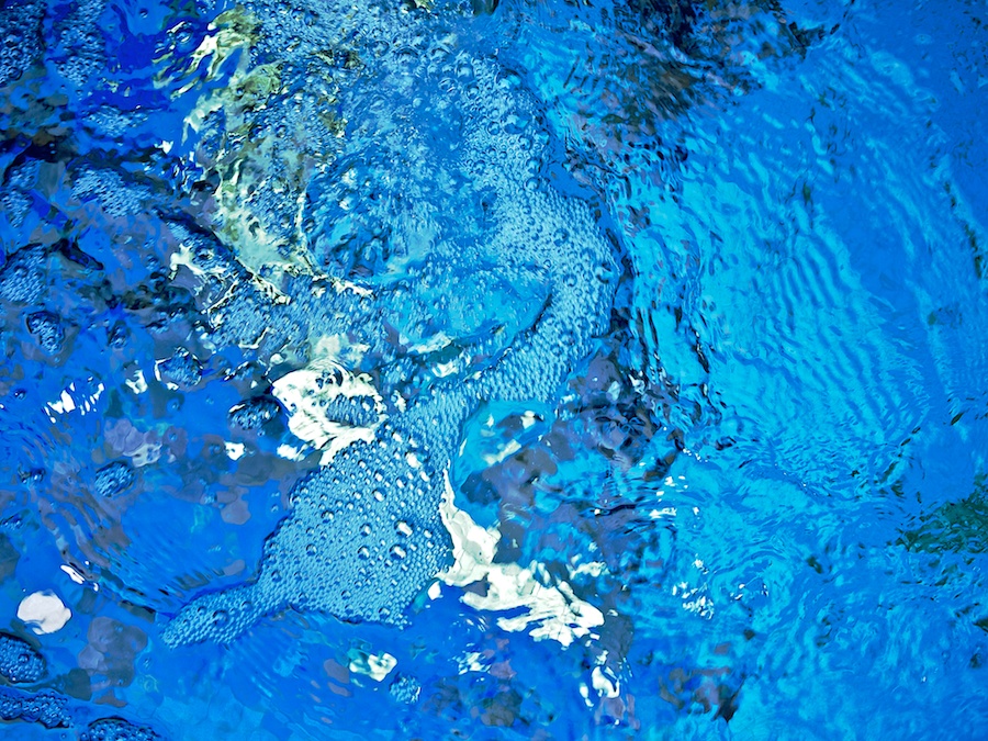 Blue water with bubbles.