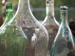 Large glass bottles in store display.