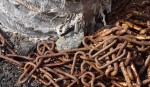 Rusty chain and frayed duct tape.