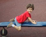 Boy on playground equipment.