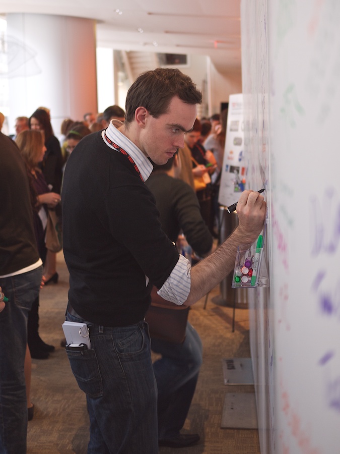 Man writing on comment wall, TEDxMidAtlantic