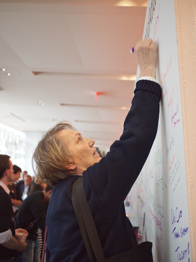 Woman writing on community wall at TEDxMidAtlantic 2011