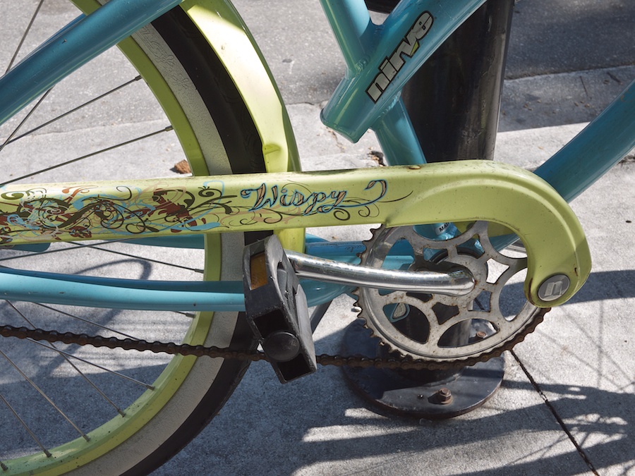 Wispy tattoo on bicycle.