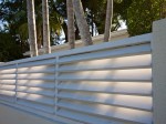 Slatted fence and palm trees, Key West.