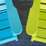 Two wood charis, brightly painted.