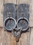 Old door knobs and locked chain.