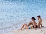 Couple lying at the water line, Key West, FL