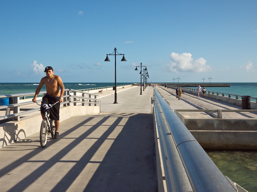 Bicyclist and pedestrian on pier, Key West, FL