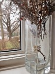 Dried flowers, vase, windowsill.
