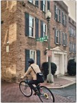 Bicyclist rides through intersection.