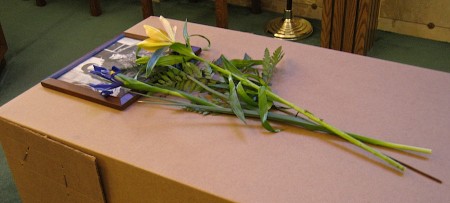 Flowers on coffin.